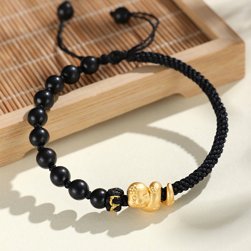 Pulsera trenzada de cuerda de algodón con cuentas de madera de ébano y sándalo rojo de hoja pequeña de Buda, año de la serpiente 999.