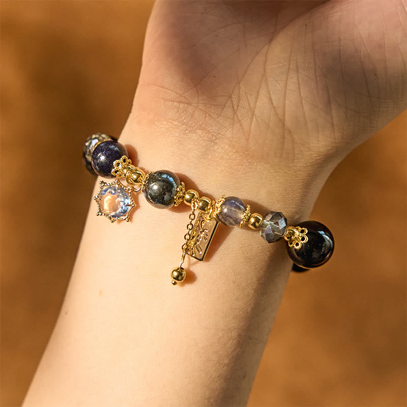 Pulsera de piedra de Buda con obsidiana negra natural, hematita y arenisca azul.