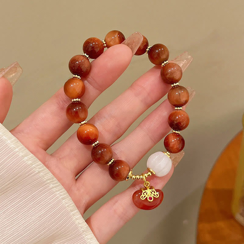 Pulsera de calabaza con ojo de tigre rojo natural y piedras de Buda