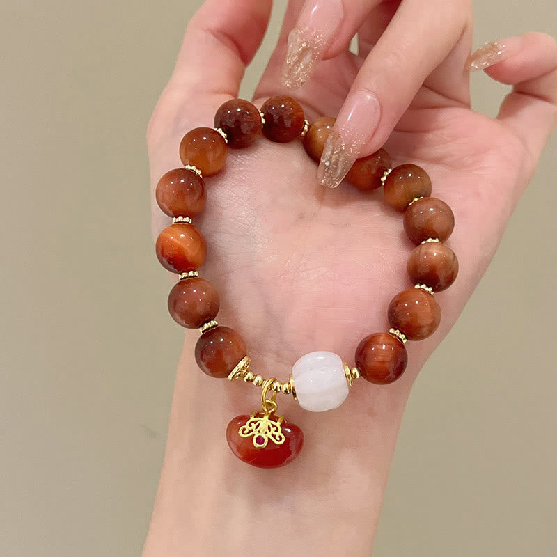 Pulsera de calabaza con ojo de tigre rojo natural y piedras de Buda