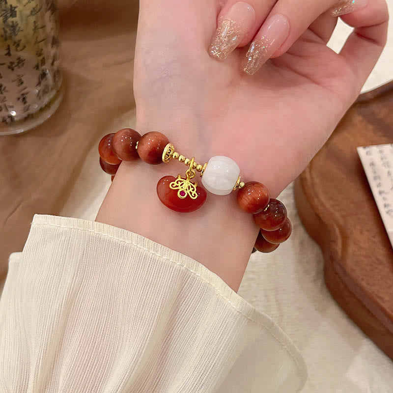 Pulsera de calabaza con ojo de tigre rojo natural y piedras de Buda
