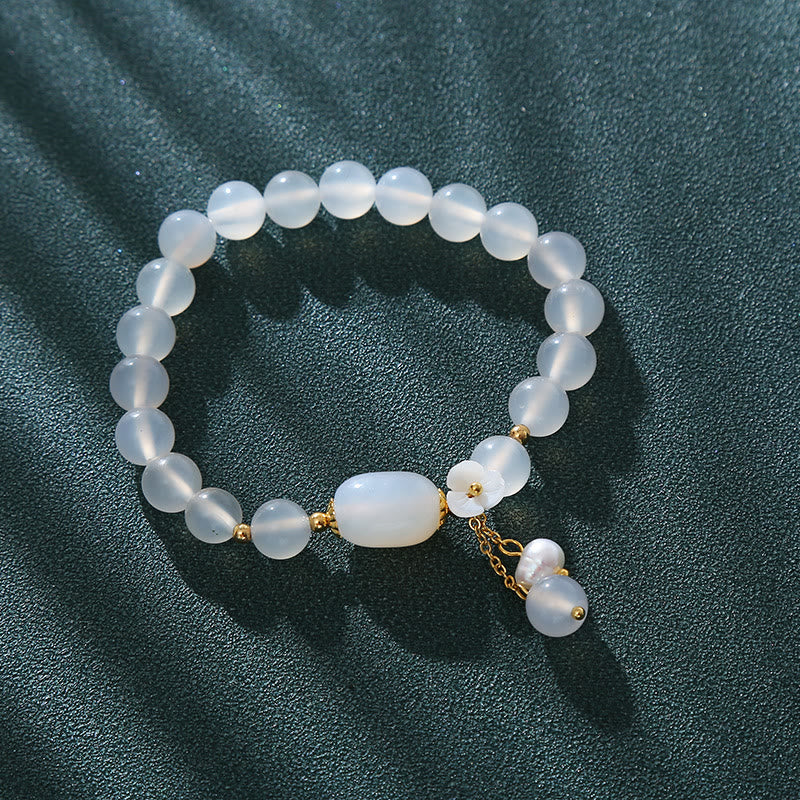 Pulsera de la suerte con flor de perla y ágata blanca de Buddha Stones