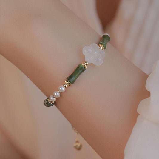 Pulsera de la paz con piedras de Buda, peridoto, bambú, flor, ágata y perla