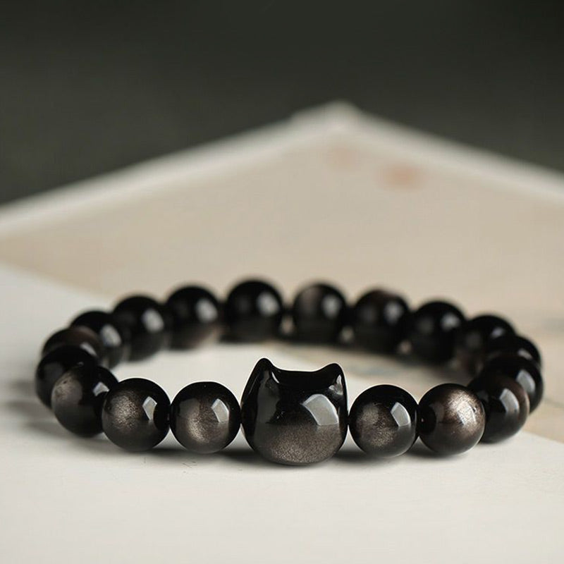 Pulsera de protección con piedras de Buda, obsidiana dorada y obsidiana plateada con brillo, con forma de pata de gato de la suerte.
