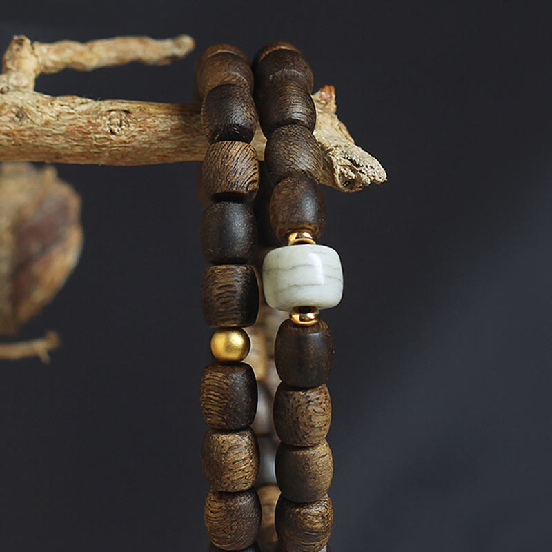 Buddha Stones 999 Gold Seltenes Tarakan-Adlerholz Tibetischer Alter Geistknochen Gleichgewicht Stärke Doppelwickelarmband