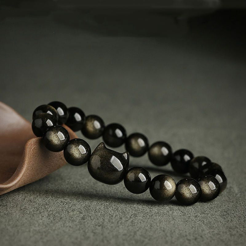 Pulsera de protección con piedras de Buda, obsidiana dorada y obsidiana plateada con brillo, con forma de pata de gato de la suerte.