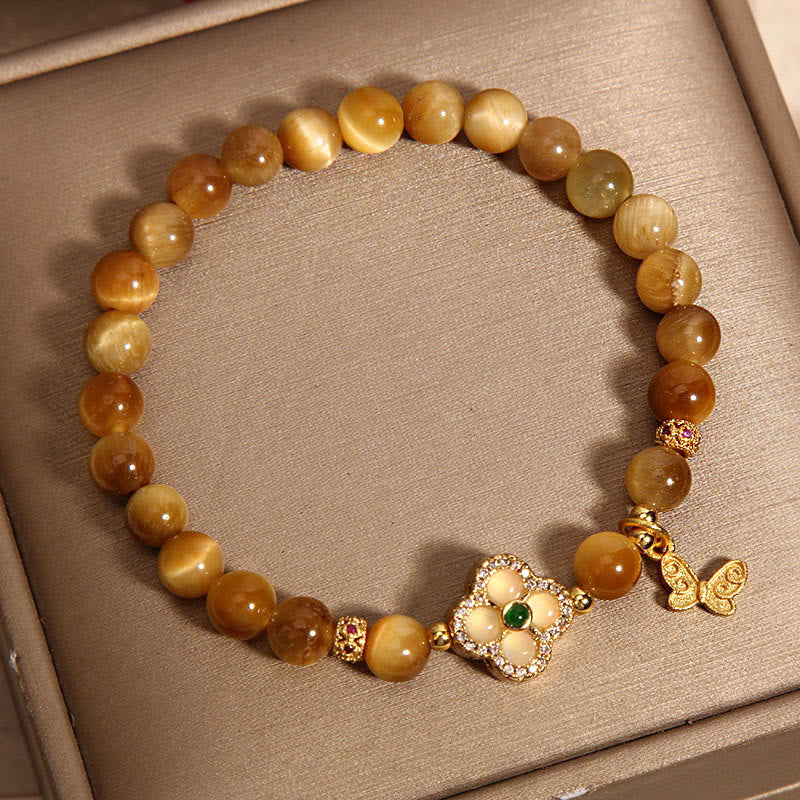 Pulsera de protección con mariposa, trébol de cuatro hojas y ojo de tigre de Buddha Stones