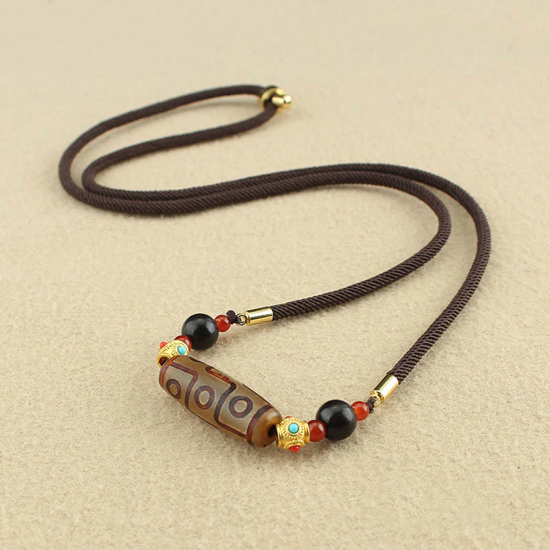 Collar con colgante de hilo con cuentas Dzi tibetanas de nueve ojos y piedras de Buda con bendiciones de protección