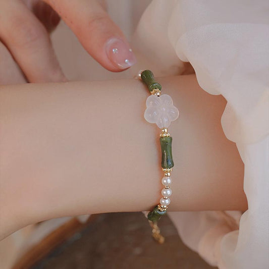 Pulsera de la paz con piedras de Buda, peridoto, bambú, flor, ágata y perla