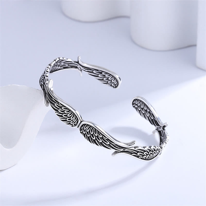 Brazalete de la suerte tallado con alas de ángel y plumas de Buda