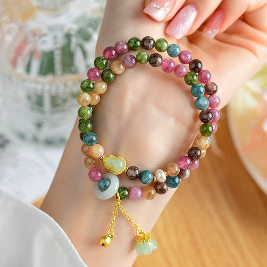 Pulsera con dijes de calabaza de turmalina multicolor y lirio de los valles de doble vuelta con piedras de Buda