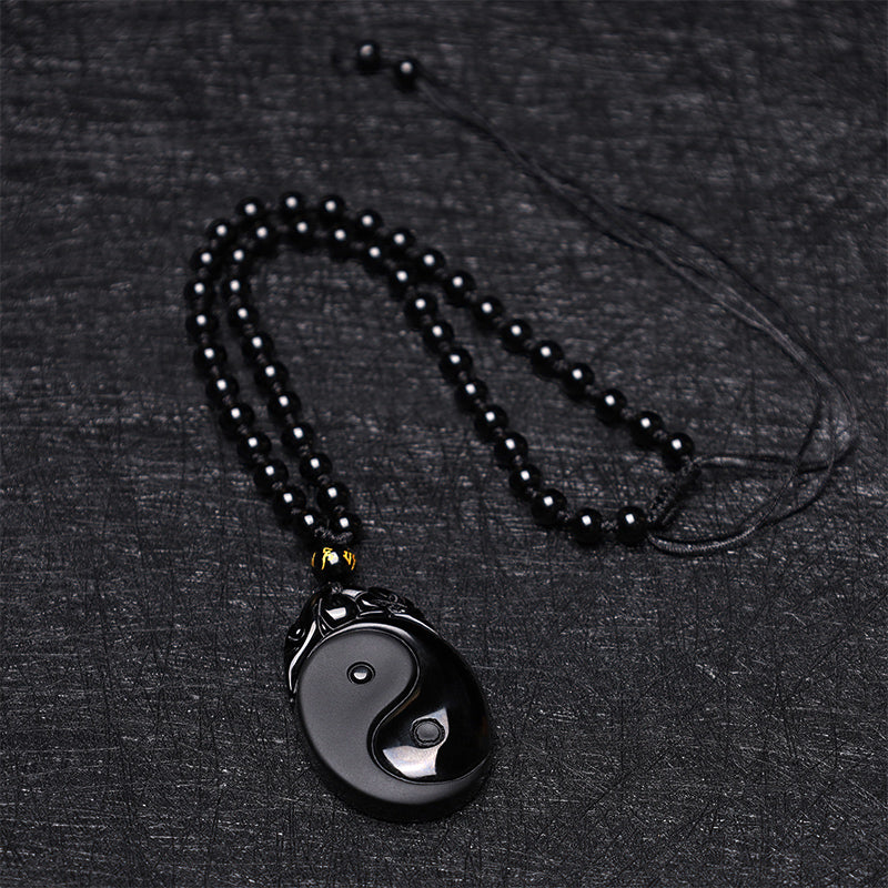 Collar con colgante de obsidiana negra natural con piedras de Buda que simboliza la fuerza y el cumplimiento del Yin Yang.