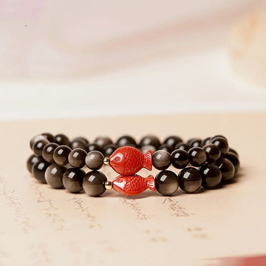 Pulsera protectora calmante con piedras de Buda, obsidiana, cinabrio y pez koi con brillo plateado natural