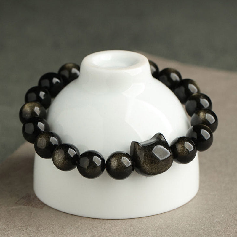 Pulsera de protección con piedras de Buda, obsidiana dorada y obsidiana plateada con brillo, con forma de pata de gato de la suerte.
