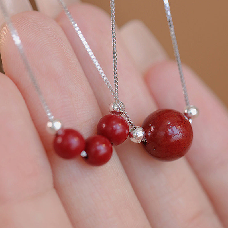 Collar con colgante de bendición de la calma con cuentas de cinabrio de Buda en plata de ley 925