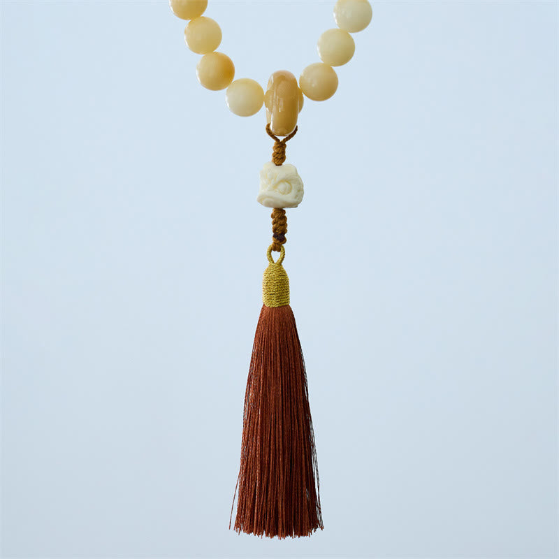 Mala de muñeca con borla de armonía y amuleto de león danzante de marfil con semillas de bodhi naturales de Buda