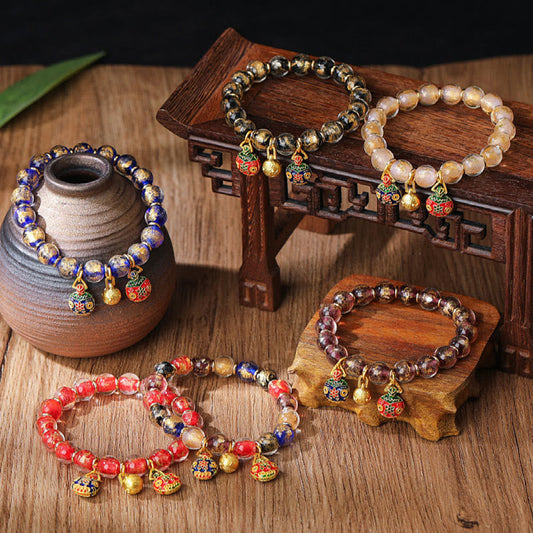 Pulsera con abalorios de cristal Liuli con piedras de Buda, doradas y plateadas, con la familia de la bestia devoradora de oro.