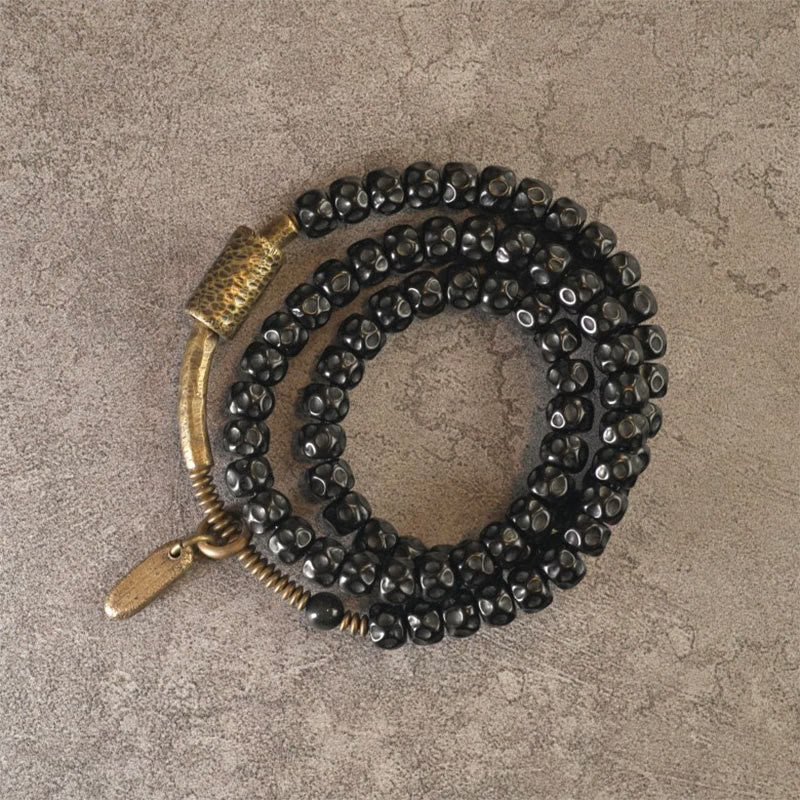 Pulsera de triple vuelta de cobre con cáscara de coco retro de Buddha Stones