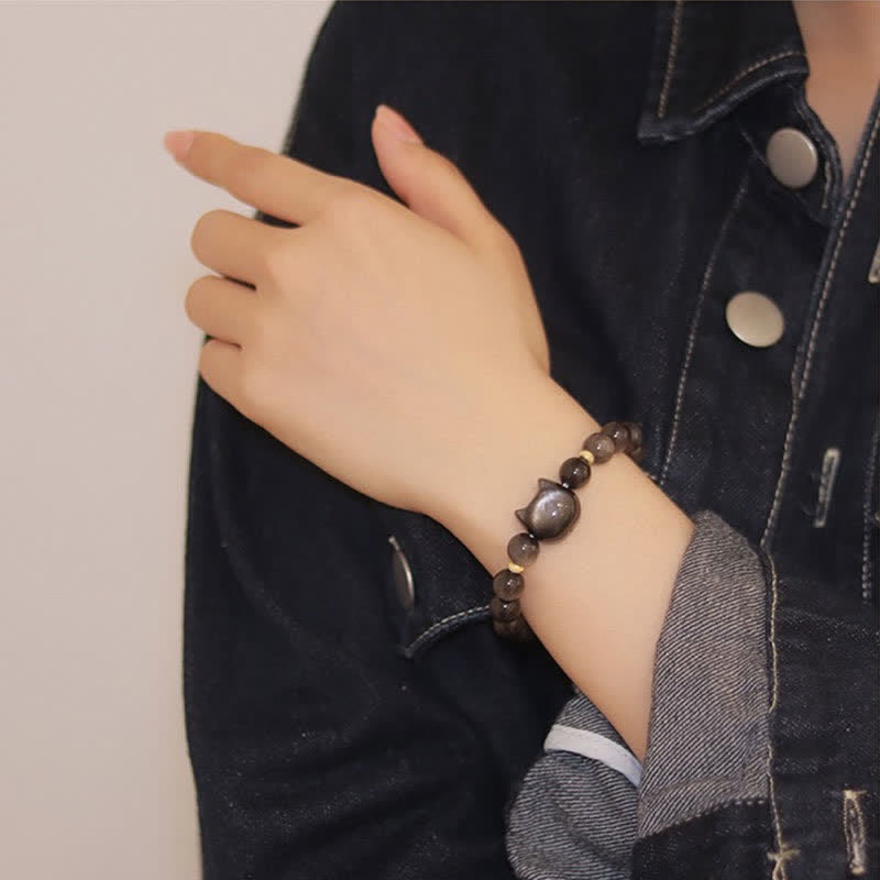 Pulsera de protección con piedras de Buda, obsidiana dorada y obsidiana plateada con brillo, con forma de pata de gato de la suerte.