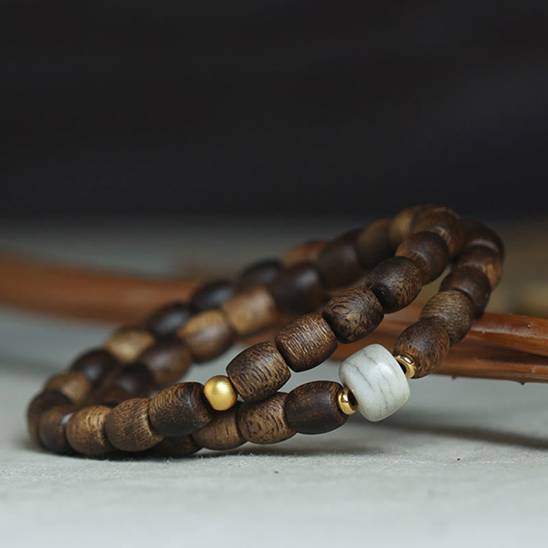 Buddha Stones 999 Gold Seltenes Tarakan-Adlerholz Tibetischer Alter Geistknochen Gleichgewicht Stärke Doppelwickelarmband