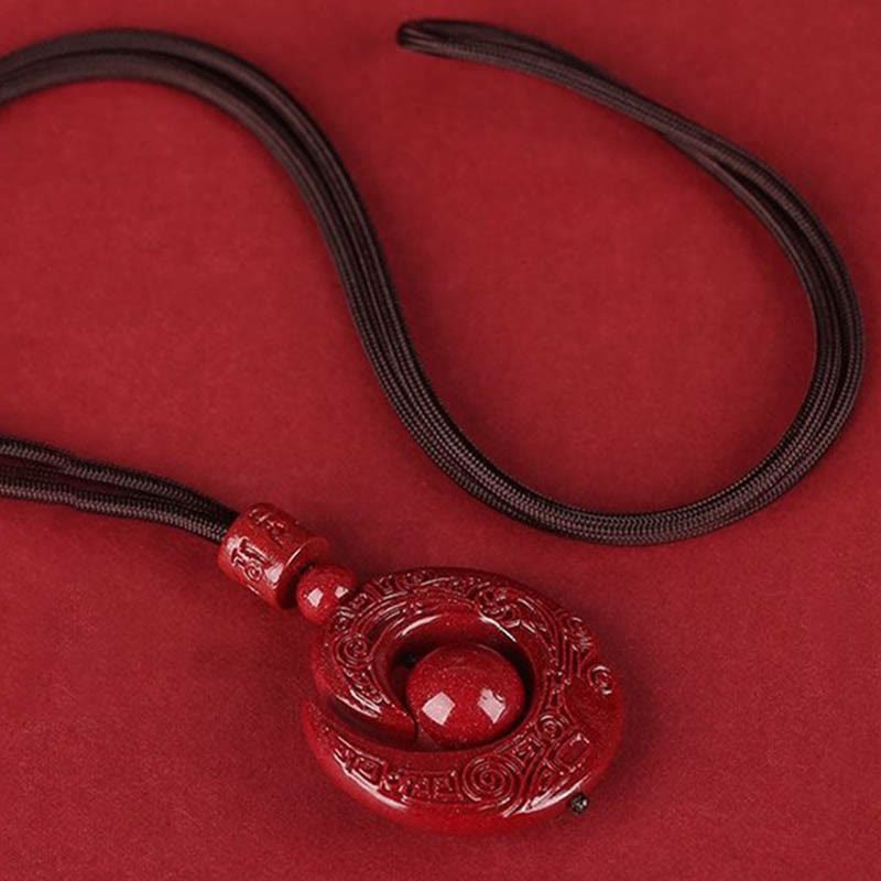 Colgante de collar con diseño de piedras de Buda que mejoran la suerte y la concentración de cinabrio natural.