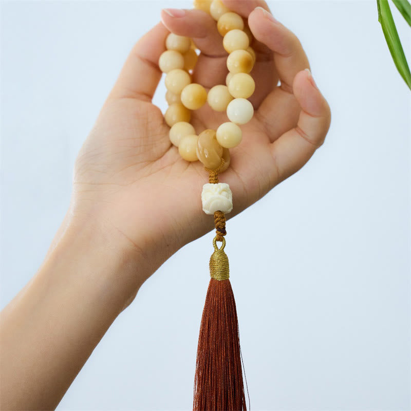 Mala de muñeca con borla de armonía y amuleto de león danzante de marfil con semillas de bodhi naturales de Buda