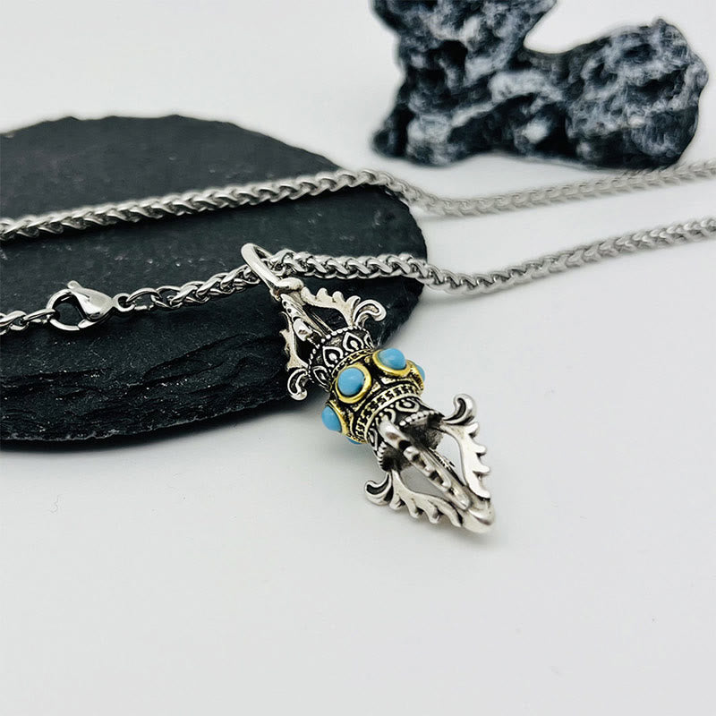 Collar con colgante de metal de cobre con diseño de dorje vajra tibetano y piedras de Buda.