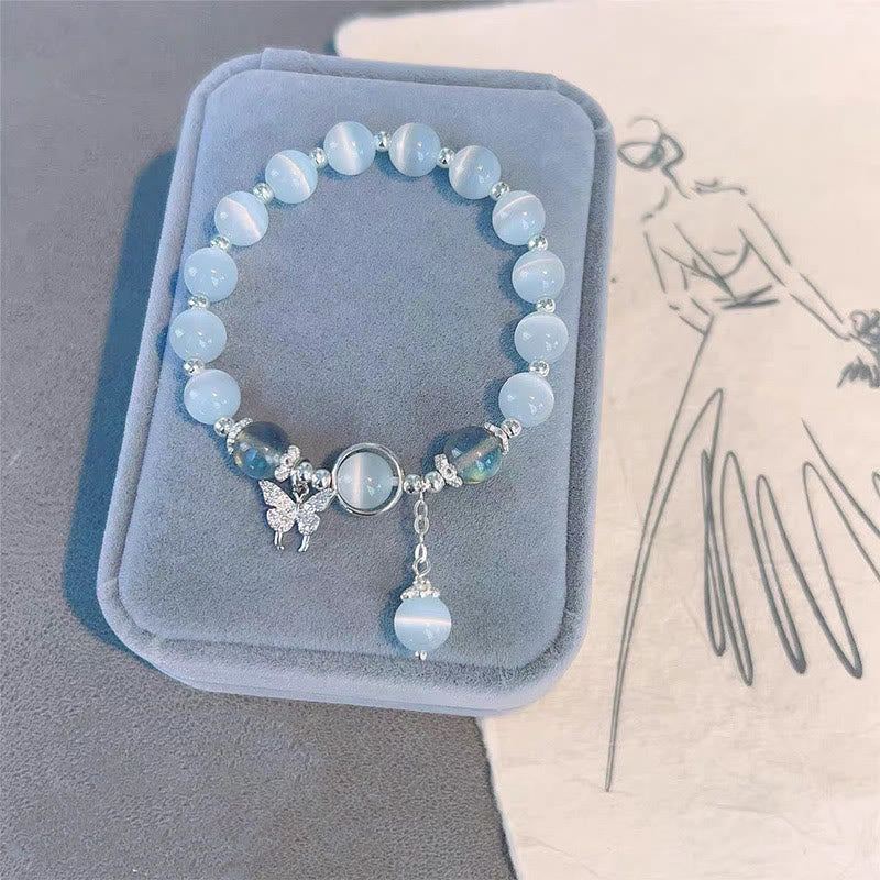Pulsera de soporte con dije de estrella y mariposa con piedra lunar y ojo de gato de Buddha Stones
