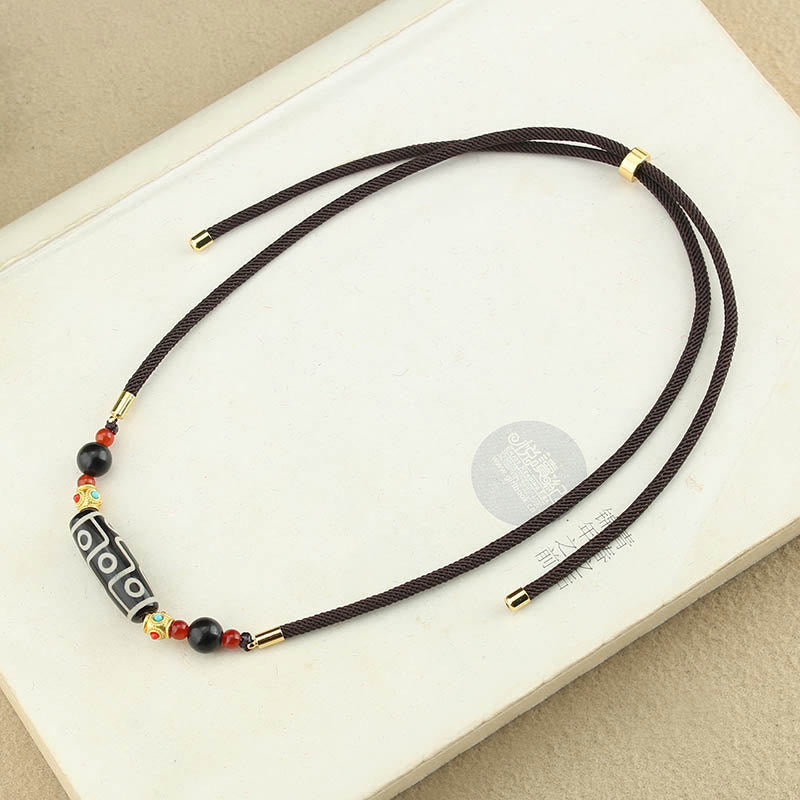 Collar con colgante de hilo con cuentas Dzi tibetanas de nueve ojos y piedras de Buda con bendiciones de protección