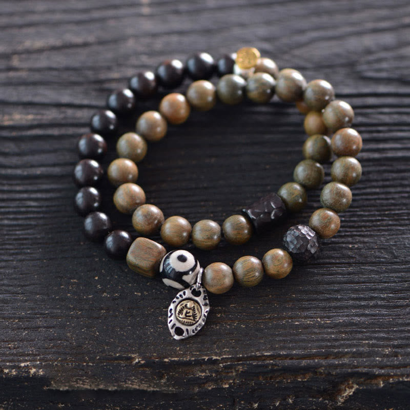 Pulsera de doble vuelta con cuentas Dzi de tres ojos de madera de ébano y sándalo verde tibetano con piedras de Buda y carácter Fu, equilibrio y paz.