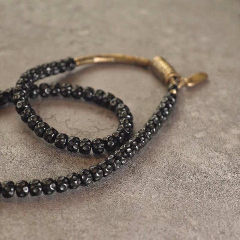 Pulsera de triple vuelta de cobre con cáscara de coco retro de Buddha Stones