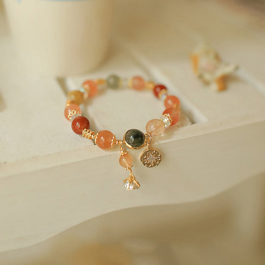 Pulsera de la riqueza con flor de estrella de ocho puntas de cuarzo rutilado multicolor natural de Buddha Stones