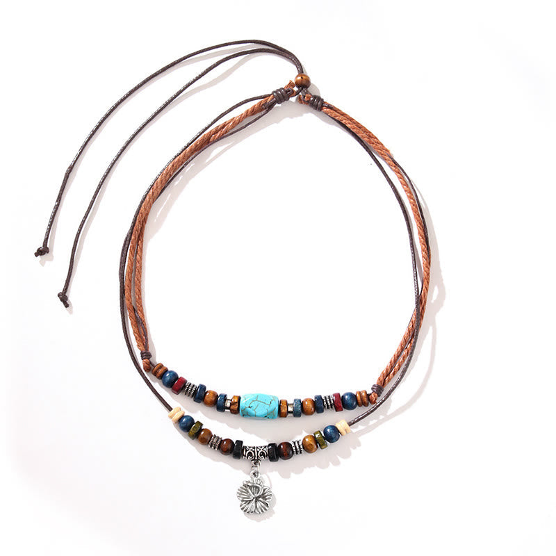 Pulsera con colgante de doble capa con protección de pequeñas flores turquesas y piedras de Buda