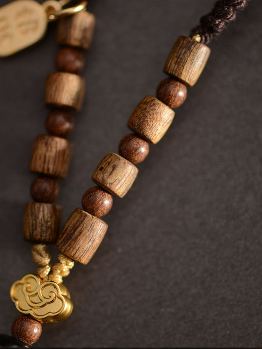 Anhänger aus tibetischen Dzi-Perlen aus Agarholz