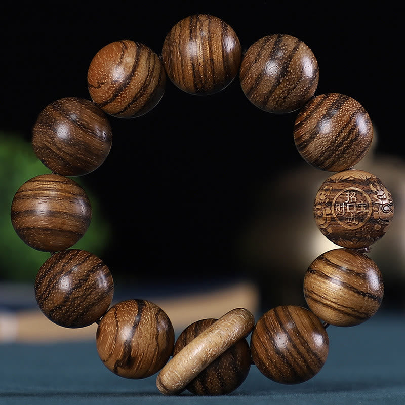 Pulsera de la calma con piedras de Buda, zodíaco chino, palisandro, sándalo verde, madera de ébano y moneda de cobre tallada.