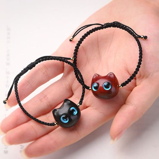 Pulsera trenzada con piedras de Buda, hoja pequeña, sándalo rojo, madera de ébano y cabeza de gato, protección y calma.