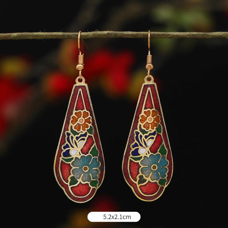Pendientes colgantes de cobre con diseño de flor de loto y mariposa de Buda y piedras de iluminación