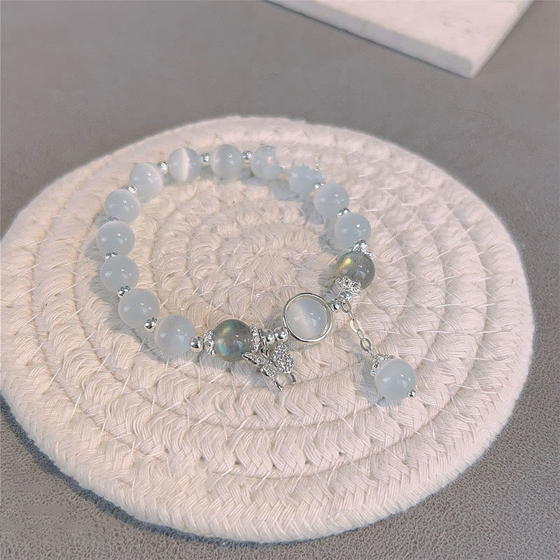 Pulsera de soporte con dije de estrella y mariposa con piedra lunar y ojo de gato de Buddha Stones