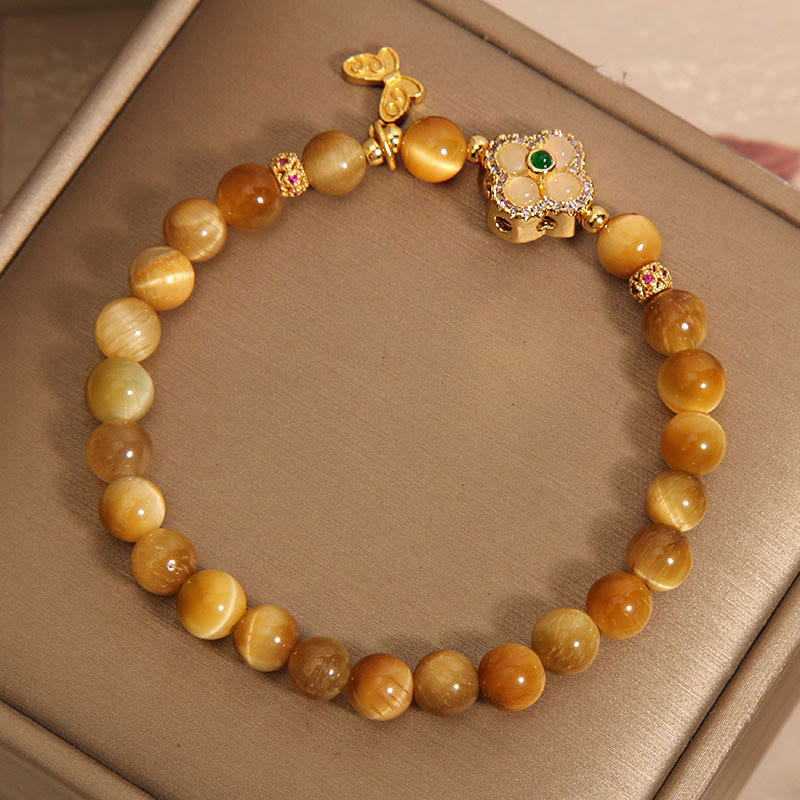 Pulsera de protección con mariposa, trébol de cuatro hojas y ojo de tigre de Buddha Stones