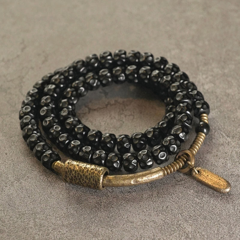 Pulsera de triple vuelta de cobre con cáscara de coco retro de Buddha Stones