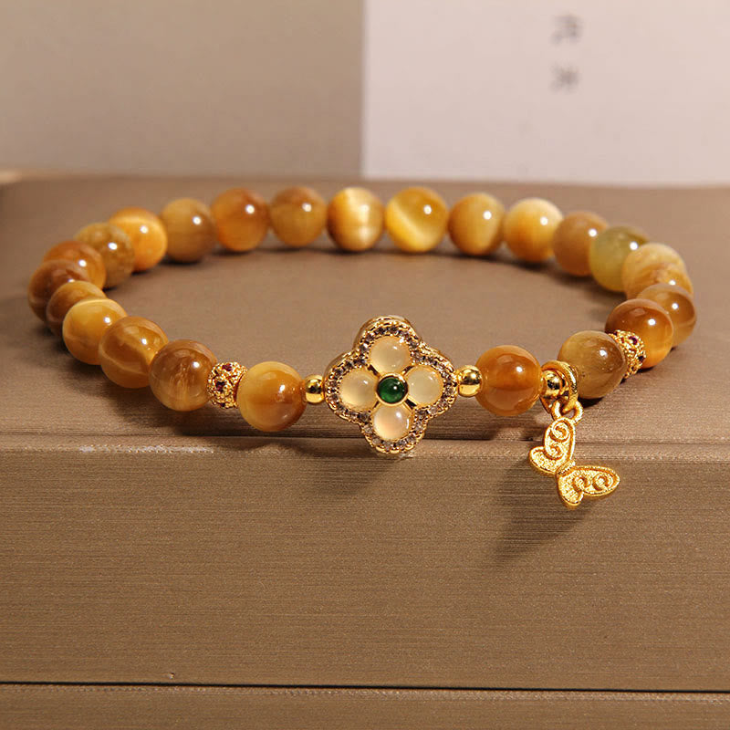 Pulsera de protección con mariposa, trébol de cuatro hojas y ojo de tigre de Buddha Stones