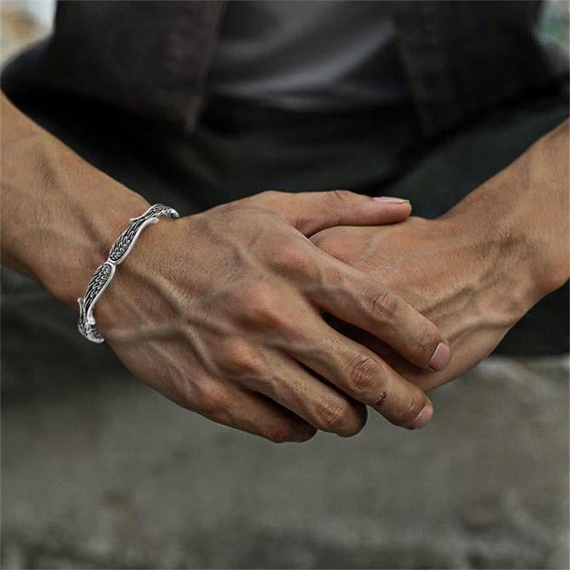 Brazalete de la suerte tallado con alas de ángel y plumas de Buda