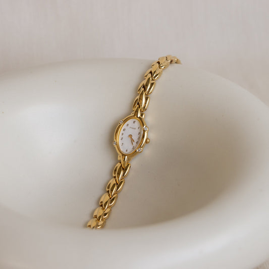 Reloj vintage Seiko Tissé ovalado de oro