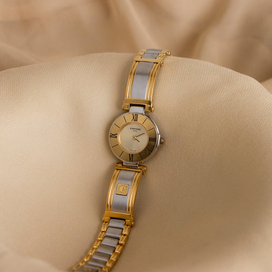 Reloj suizo vintage Carven con brazalete redondo en dos tonos