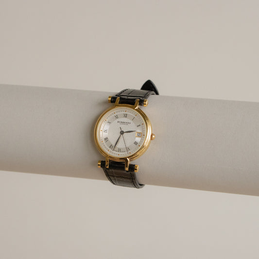 Reloj vintage Burberry suizo con correa negra y dorado
