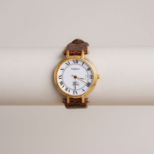 Reloj vintage Burberrys con correa de cuero suizo dorado