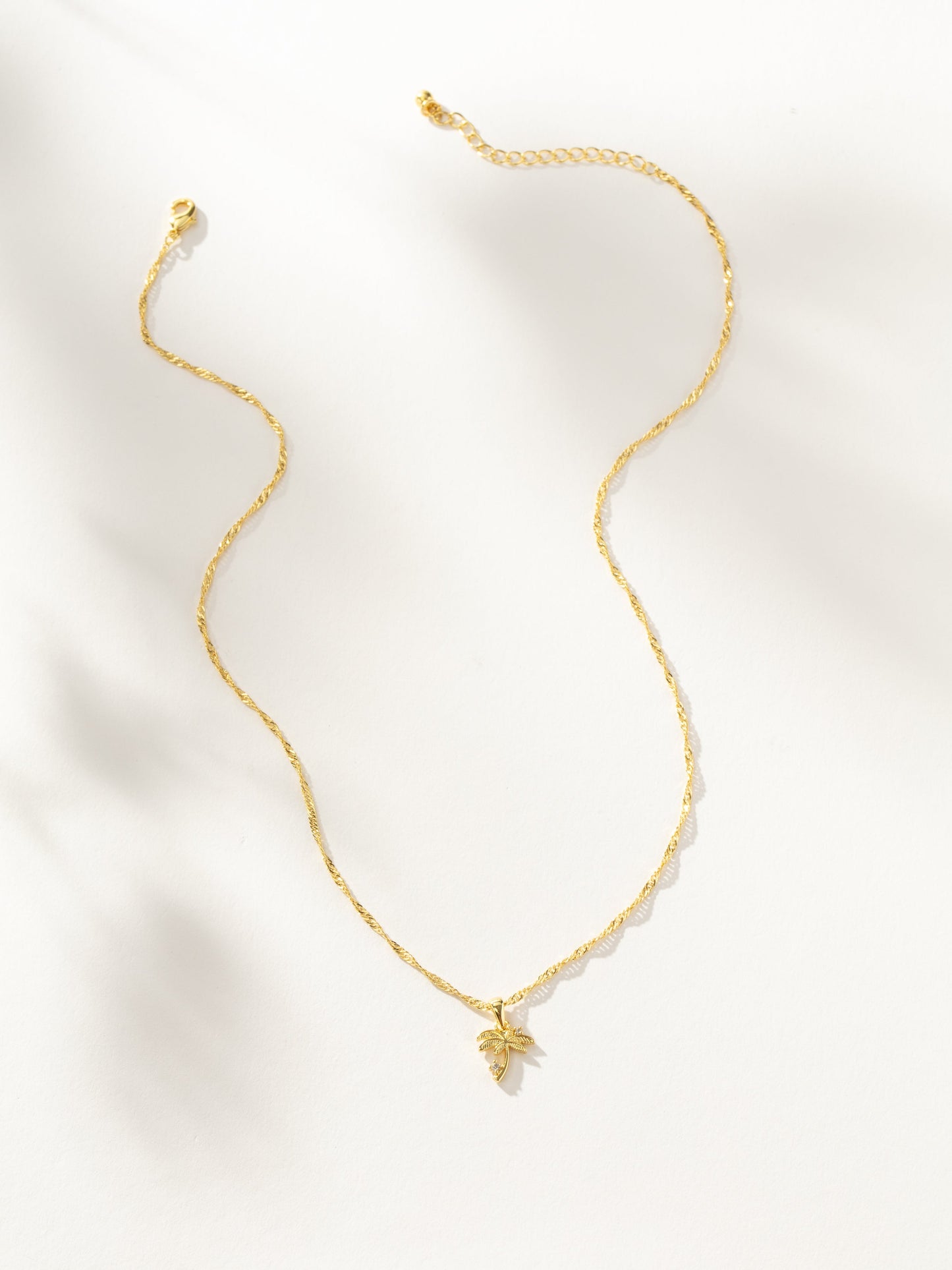 Collar con colgante de palmera