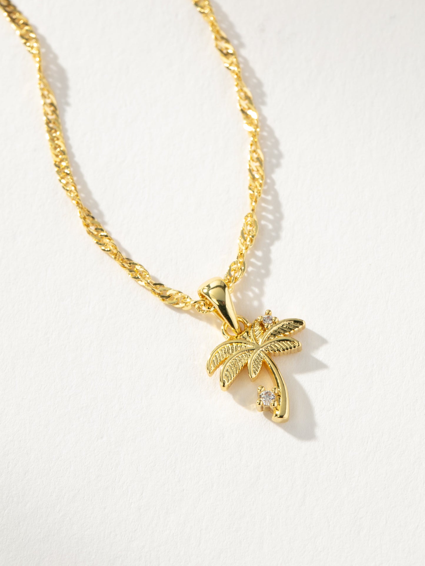 Collar con colgante de palmera