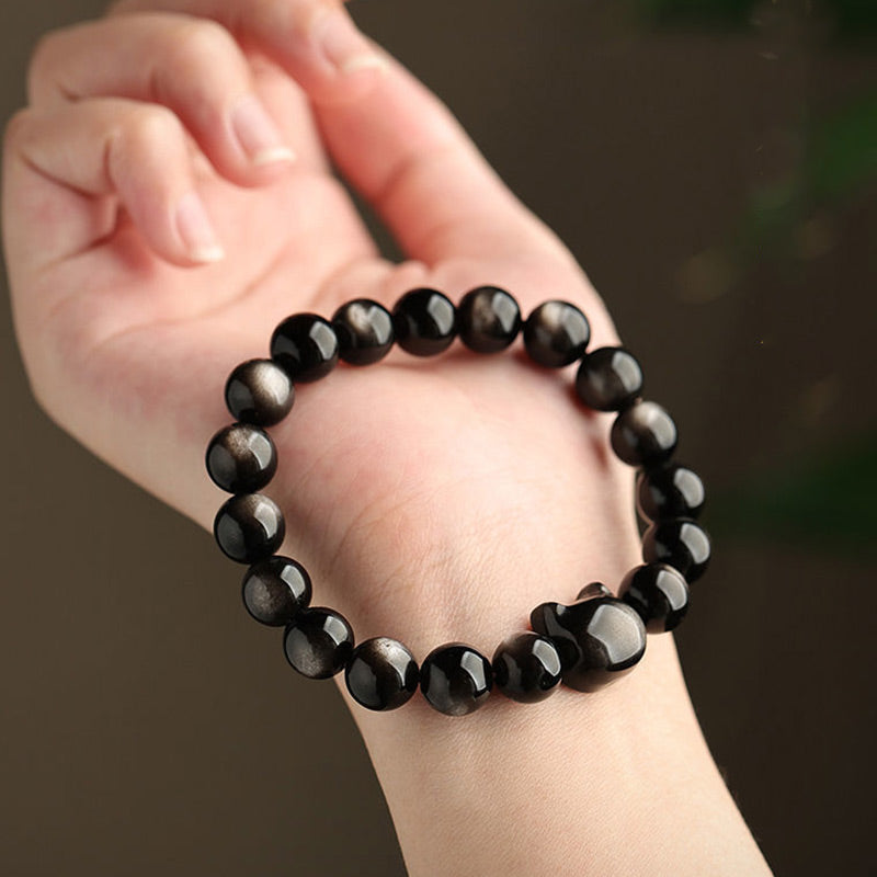 Pulsera de protección con piedras de Buda, obsidiana dorada y obsidiana plateada con brillo, con forma de pata de gato de la suerte.