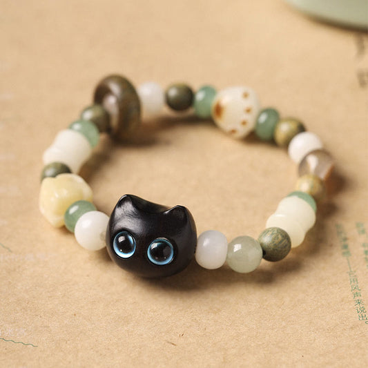 Pulsera de la paz con piedras de Buda, semillas de Bodhi, sándalo verde, madera de ébano, hoja pequeña, sándalo rojo, cabeza de gato y garra.